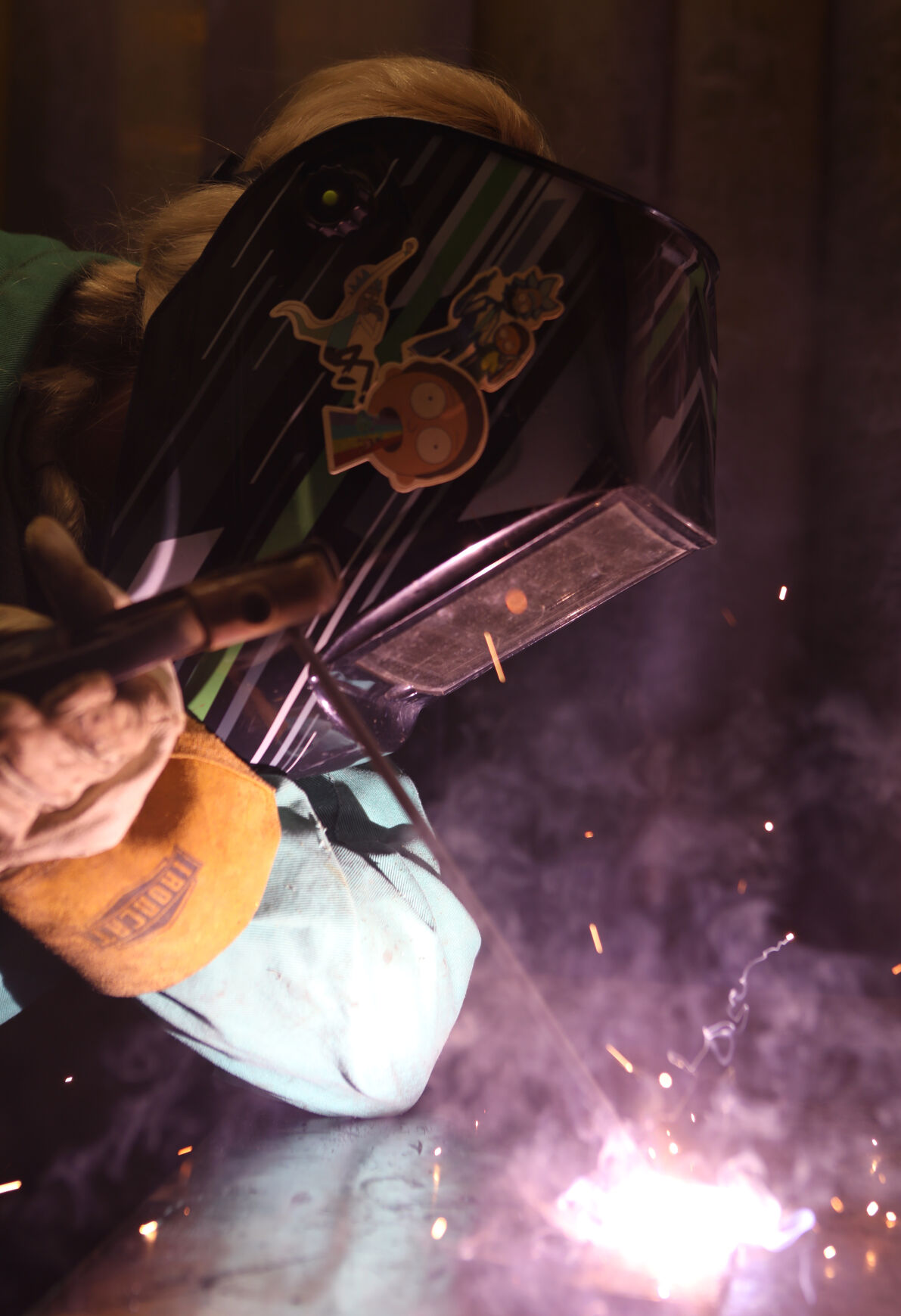 Michaela Redeker welds during class